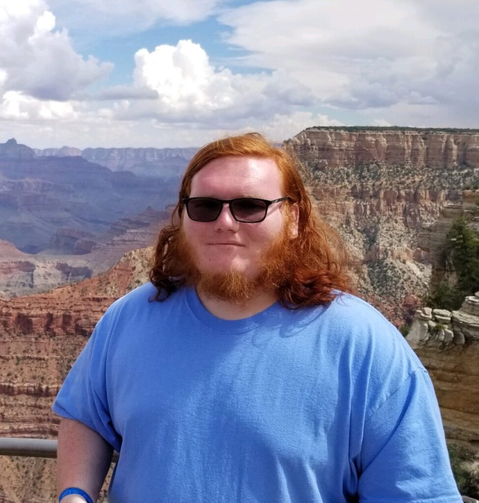 Headshot of Evan at the Grand Canyon